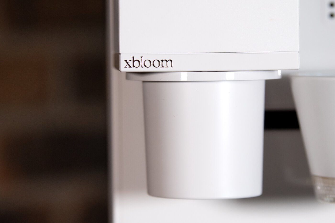 Detalle del dosificador y la celda de molienda de la cafetera xBloom Original
